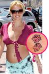 Britney spears pink dice hand tattoo